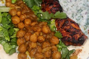 GRILLED SALMON WITH CURRIED CHIC PEAS, CORIANDER AND AND HOME MADE YOGURT AND MINT SAUCE. 