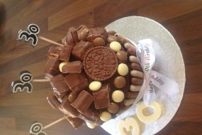 Giant chocolate cupcake with chocolate bars on the top 