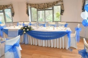 Ivory Stretch Chair Covers + Royal Blue Organza Sash