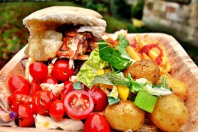 Pork Roll served with sides and salad