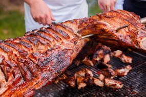 Hog Spit Roast - Our hog spit roast is cooked over traditional hot coals, ensuring an authentic and flavoursome experience.