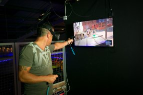 An Adult in VR Zombie Shooting Multiplayer