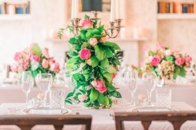 Romatic classic styling of the venue and chic floral arragements
