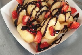 Donuts with Fresh Strawberries and Chocolate Sauce