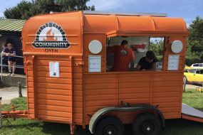 Our famous orange pizza van, homemade by ourselves!