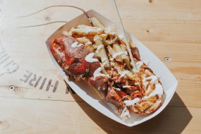 Paprika and lemon butter grilled lobster with truffle salted Parmesan fries