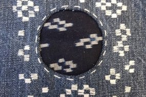 Hitomezashi Sashiko mend using vintage Kasuri fabric on jeans