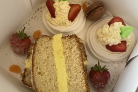 Strawberry meringues with fresh cream, lemon drizzle loaf cake filled with lemon butter cream, macaroons 