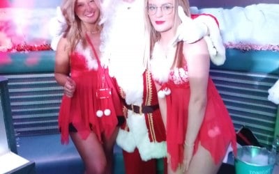 Santa Claus with 2 elf's at a nightclub
