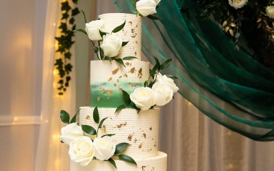 Forest green ombre and gold leaf wedding cake.