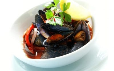 Mussels cooked in a spicy African sauce taste of Afica