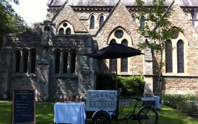 Ice cream tricycle outside a church