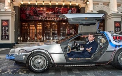 The BTTF Car Delorean Time Machine being used in Opening Title of Sunday Night at the Palladium 2014