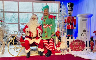Santa Claus and an elf at Hotel event