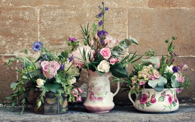 Home grown flowers in china jugs and vintage tins