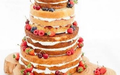 Naked wedding cake with fresh berries