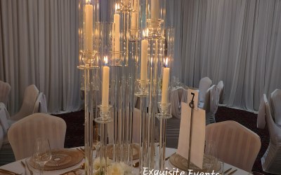 Tall candlesticks centerpiece with florals