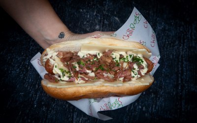 Our Cuban Dog topped with ham hock, swiss cheese, gherkins and 3-mustard mayo