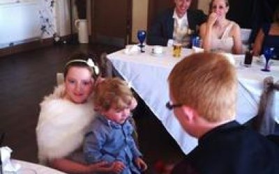 Performing magic for children at a wedding