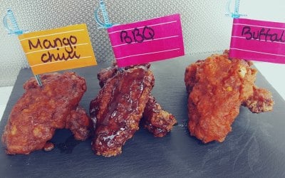Our Banging Wings Tossed in 3 home made sauces Smokey Bar B  Mango Chili  Buffalo