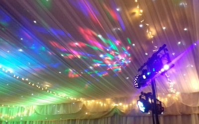 Disco lights on draped ceiling