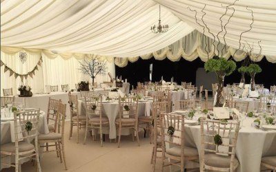 Royston Marquees white marquee theme with reveal wall