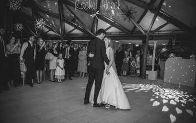 A beautiful first dance with hearts projected onto the floor 