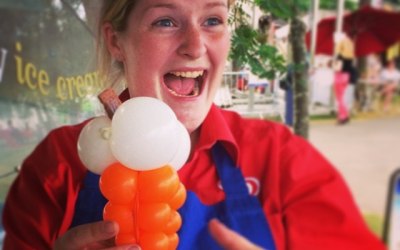 The Conwy Jester makes ice-cream seller smile with balloon ice-cream.