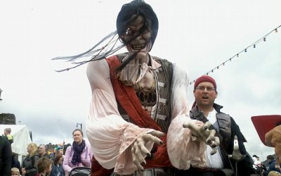 The Conwy Jester with 9 foot tall pirate puppet at pirate festival.