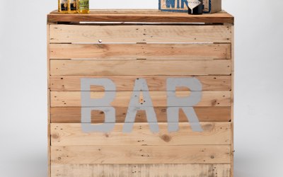 Truly the flagship of the Party Pallets range. Each Bar is handmade with reclaimed pallet wood. Units can be linked together to make a circular bar and bespoke stenciling can be arranged. The Bar has in built shelves for bottles and glasses.  1.2m in length, 0.6m deep and 1.1m in height.