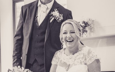Ruth and Dave thoroughly enjoyed their wedding day! They couldn't stop laughing whilst signing the register!
