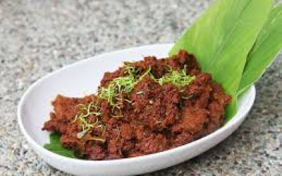 Beef Rendang - Flaky Beef Chunks, coated in a rich dry curry, slow pulled to capture the aroma of the Far East