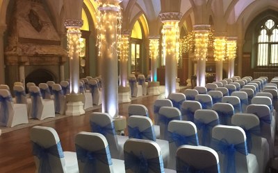White chair covers and royal blue organza sashes