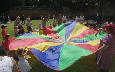 Parachute games at a public picnic event