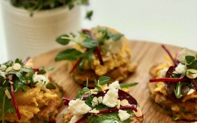 Carrot fritters with humus, beetroot salad and feta for a buffet 