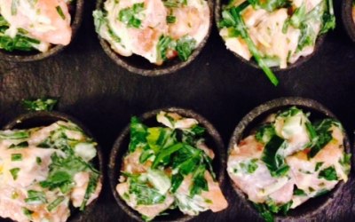 Salmon and fresh herb tartare in a charcoal case