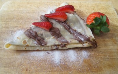 crepe with nutella, strawberry and caster sugar topping