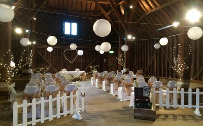 Lace chair covers, lanterns and fairy-lit heart