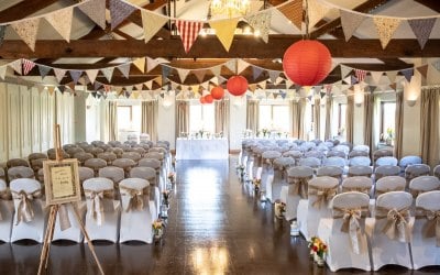 White chair covers & Hessian Sashes and Bunting.