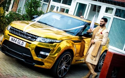 Groom with Gold Range Rover