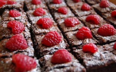 Brownies topped with fresh raspberries