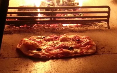 Mmm... hot, fresh pizza cooked in our wood-fired oven 