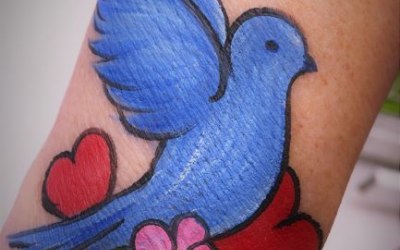 Bird and heart arm paint/tattoo