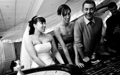 Wedding guests enjoying playing a game of roulette at one of our tables
