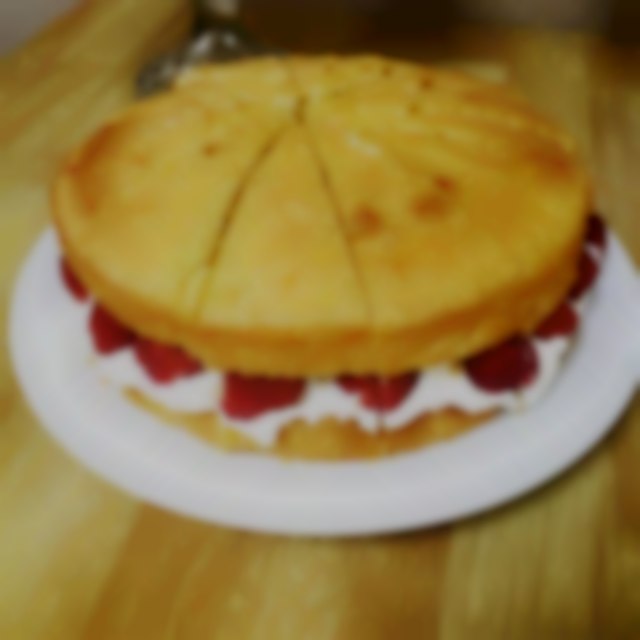 Classic Victoria sponge with fresh cream and strawberries The Pink Door Catering Co