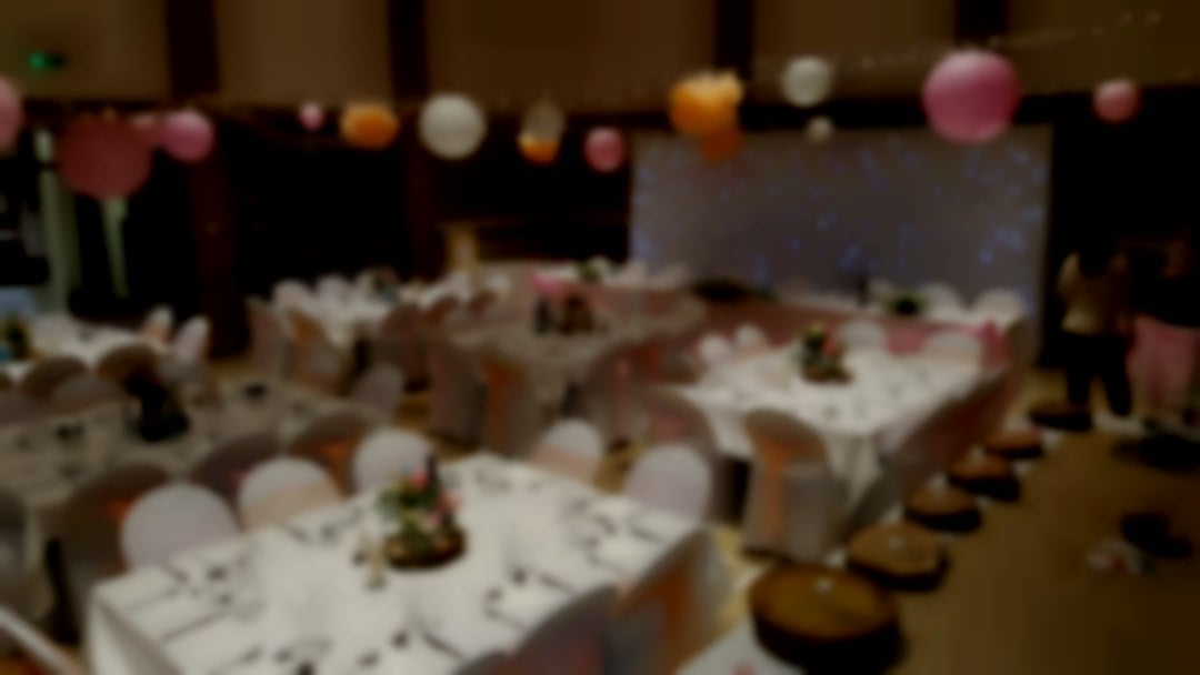 Venue dressing in Bosham village hall chair covers, table linen and starlight backdrop
