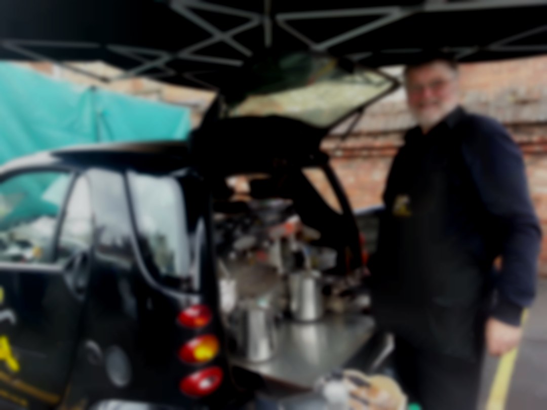 Bob serving delicious coffee! Mobile Coffee from the back of a Smart Car
