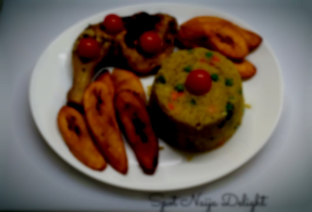 Long grain rice cooked with mixed green vegetable and carrot and spices. . Note that this meal is free of Gluten and Dairy Product. Fried Rice, Grilled Chicken Leg with Fried Ripe Plantain.
