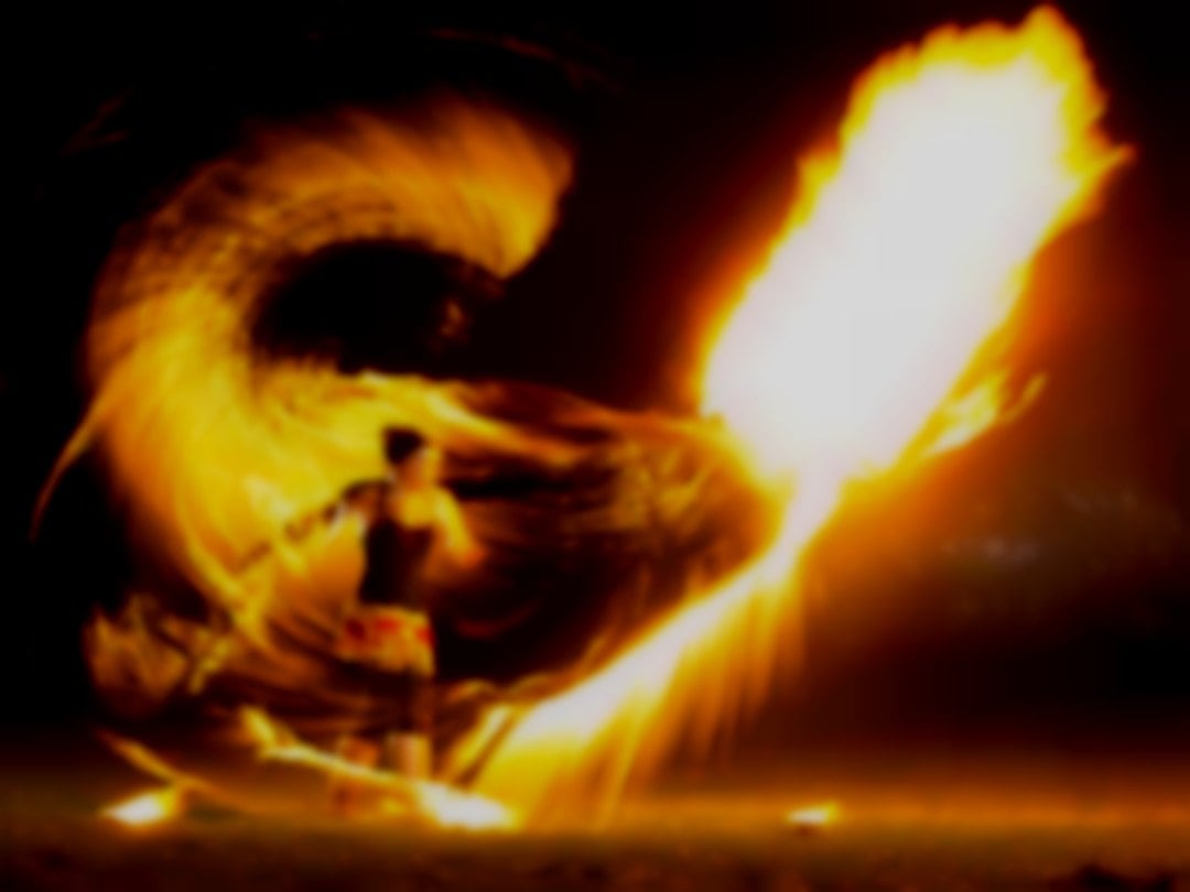 Kat Collett with her Fire Whip; see this for yourself in the 'Fire Show Extravaganza!' (Impressive fire photo with large fire ball)
