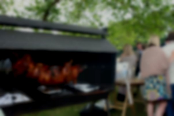 Spit roasting a pig at Henley Regatta Charcoal Spit Roast